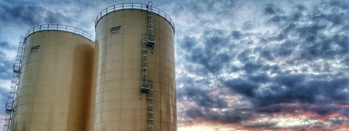 Two Laidig silos against a sunset background